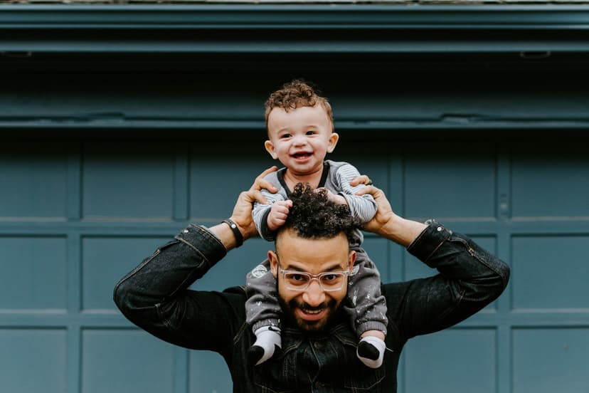 Dad and child on shoulders