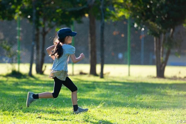 Child running in a park